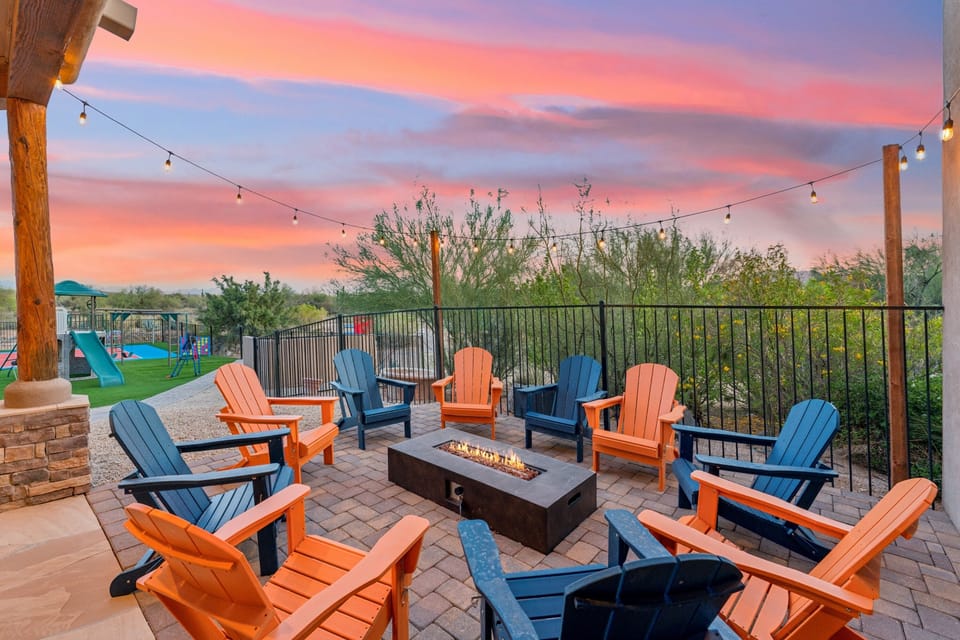 Sunset chats and starlit s’mores await around this cozy fire pit with seating for twelve—perfect for evening laughs, stories, and unwinding under desert skies. | The Sonoran, Scottsdale, Arizona | Voyax Luxury Vacation Rentals