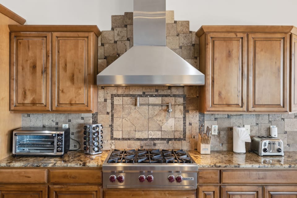 Whip up your favorites in this cheerful and fully equipped kitchen, perfect for group meals and morning coffee chats. | The Sonoran, Scottsdale, Arizona | Voyax Luxury Vacation Rentals