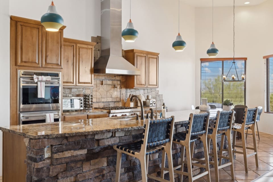 Whip up your favorites in this cheerful and fully equipped kitchen, perfect for group meals and morning coffee chats. | The Sonoran, Scottsdale, Arizona | Voyax Luxury Vacation Rentals