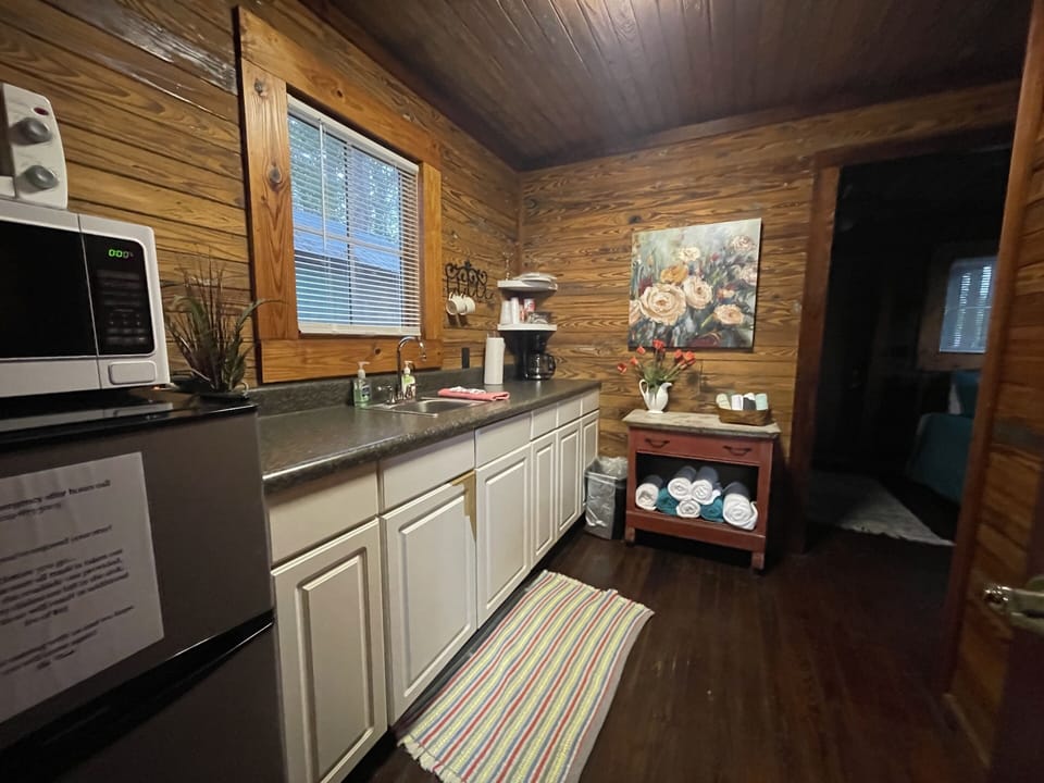 Kitchenette includes microwave, mini fridge, toaster oven & coffee pot