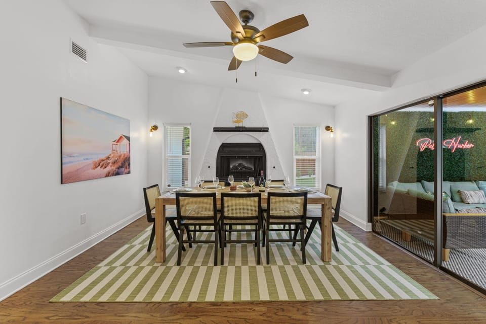 Enjoy your time in style in this spacious dining room with the view of the patio