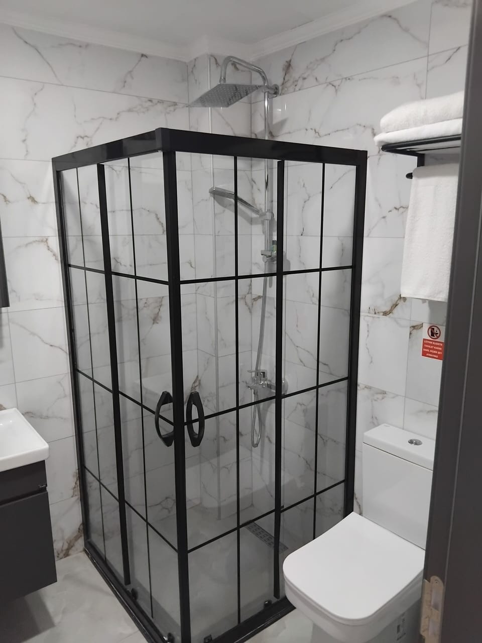 Shower, hair dryer, slippers, towels