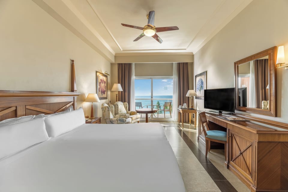 Premium bedding, down comforters, minibar, in-room safe