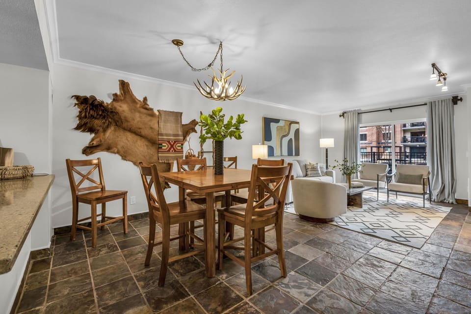 Dining Room: 4-person dining table, located between living room and kitchen