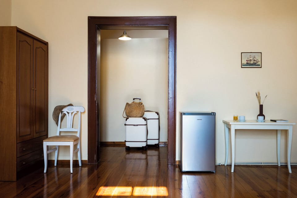 Standard Quadruple Room, 2 Bedrooms (Room 4 | Meridies) | In-room safe, desk, laptop workspace, iron/ironing board