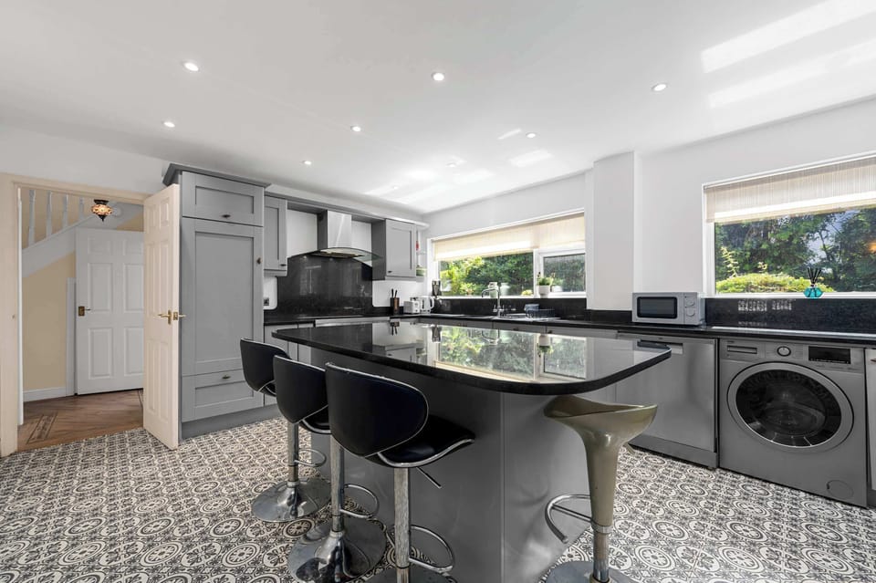 Modern kitchen with breakfast bar, washer and dryer on site so you can pack light and travel easy