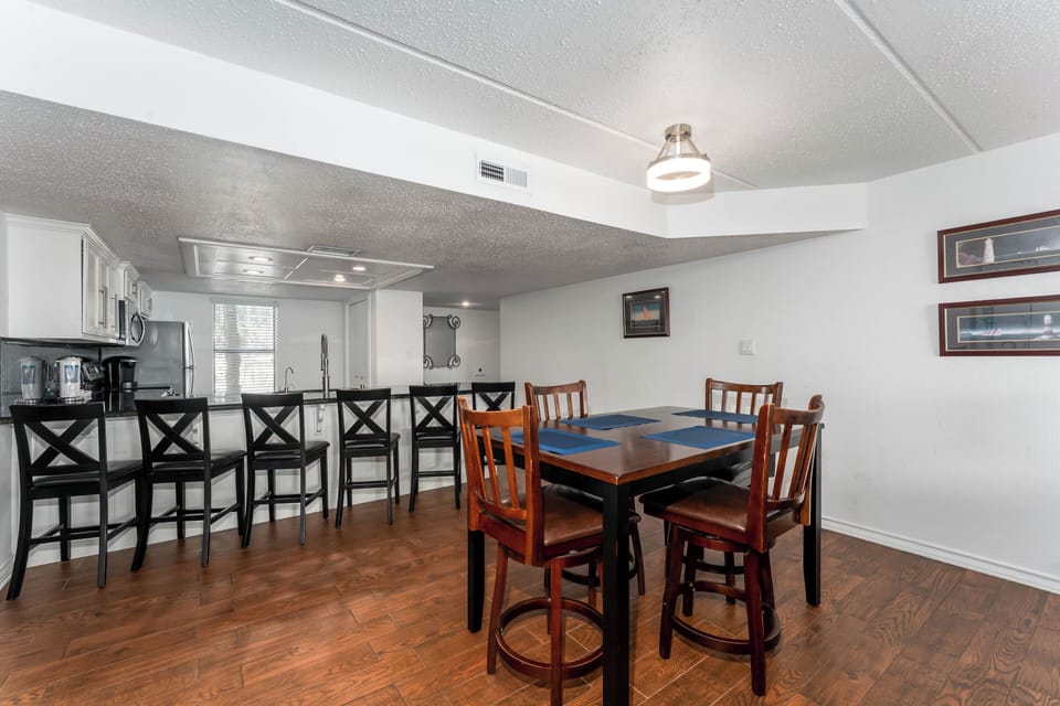 Our dining space has room for everyone! With 4 at the table and 6 more at the breakfast bar - you'll be caught up in the dinner conversation in no time!