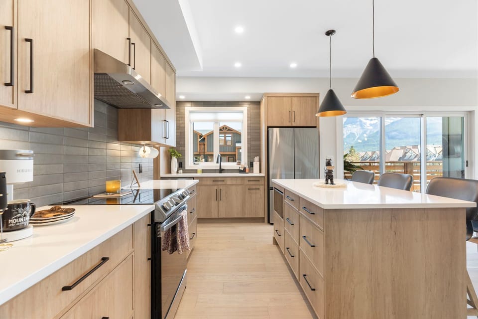 Sleek and stylish kitchen featuring a large island, perfect for meal prep and casual dining.