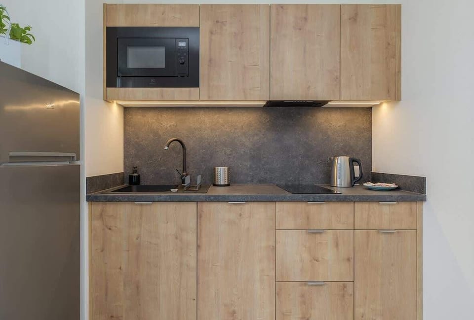 Kitchenette with a microwave.
