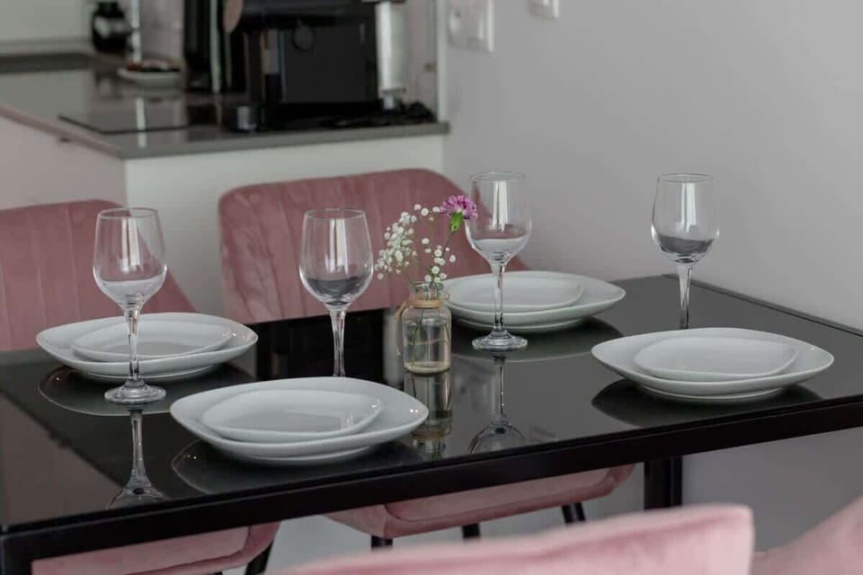 Close-up of table setting with wine glasses and dishes
Ready for a romantic dinner or celebration in style.
