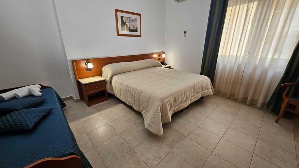 Classic Triple Room, Balcony | In-room safe, free WiFi, bed sheets