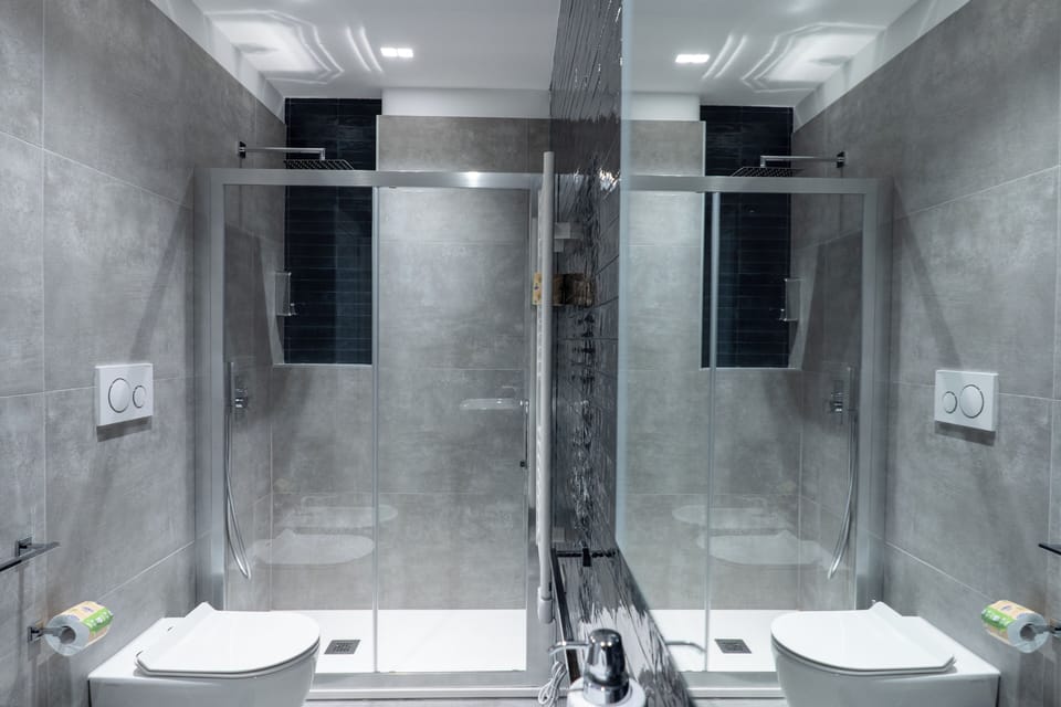 Shower, rainfall showerhead, hair dryer, towels