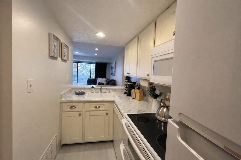 Condo, 2 Bedrooms | Private kitchen | Coffee/tea maker, fridge, oven, electric kettle