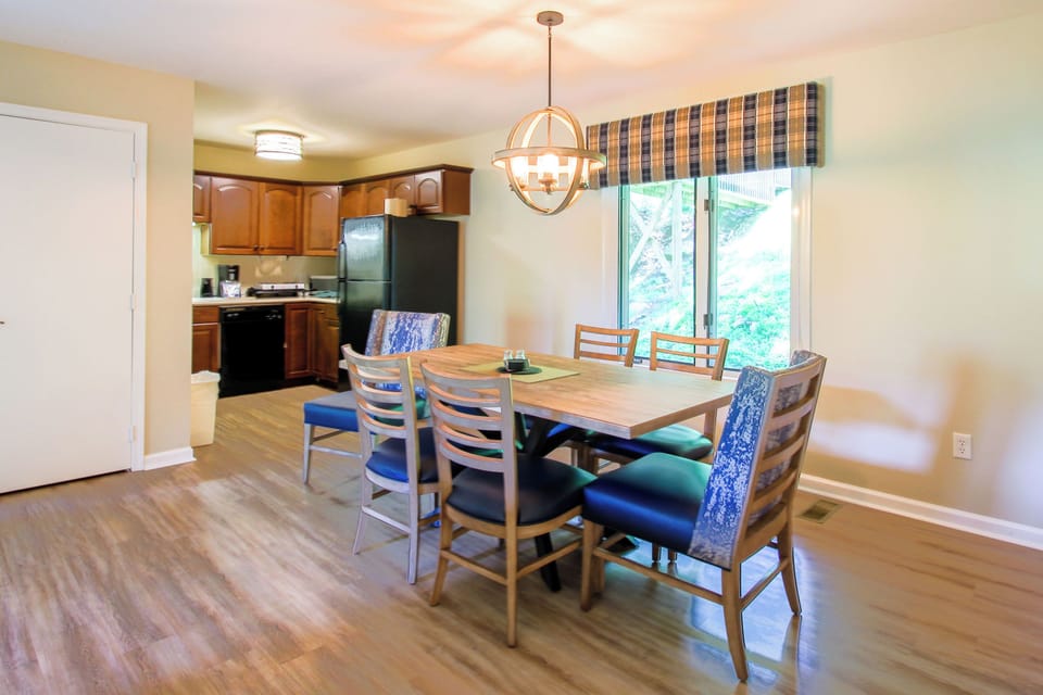 Partial kitchen and dining area