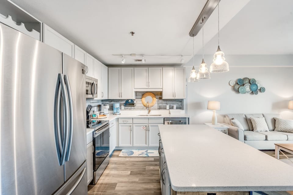 Modern kitchen with stainless steel appliances and a spacious island