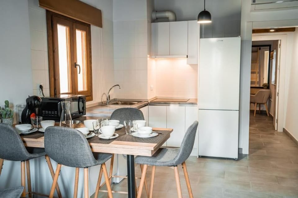 Deluxe Apartment | Living area | 50-inch TV with digital channels, smart speakers