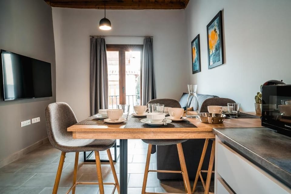Deluxe Apartment | Living area | 50-inch TV with digital channels, smart speakers