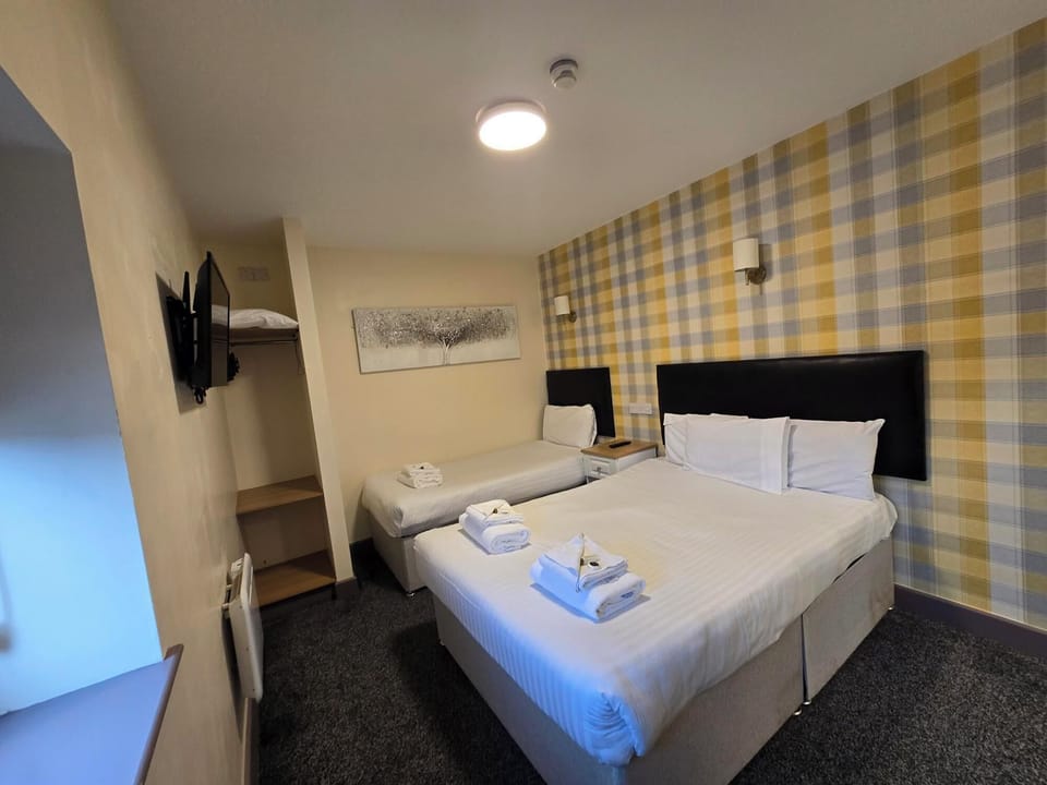 Family Room | Blackout drapes, iron/ironing board, free WiFi, bed sheets