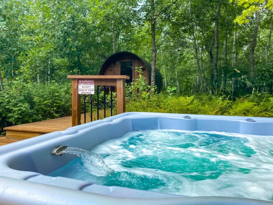 Outdoor hot tub off the back deck of the Clubhouse
