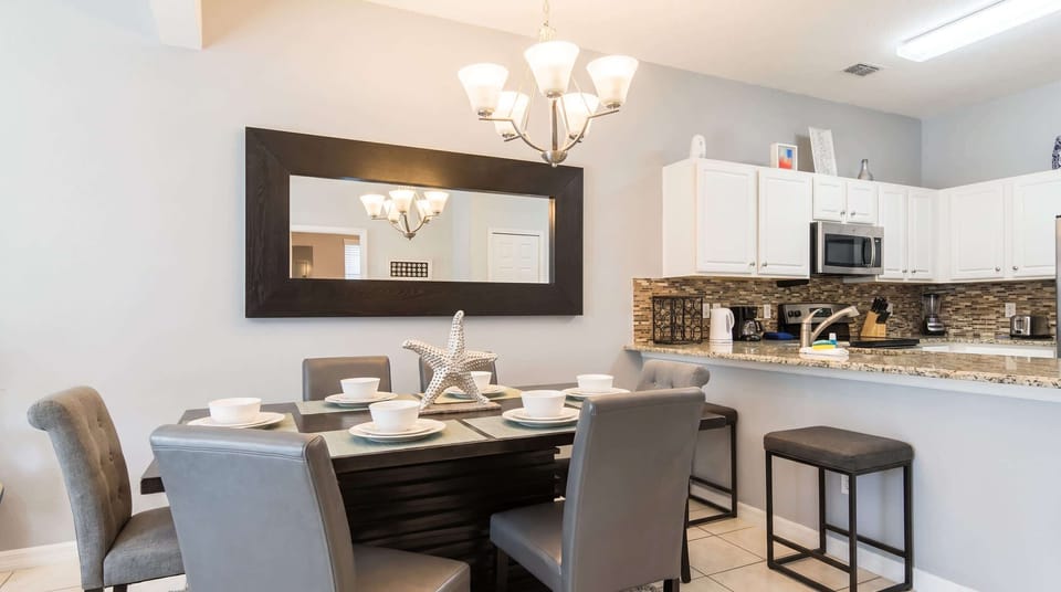 Stylish dining area with modern decor, perfect for cozy meals!