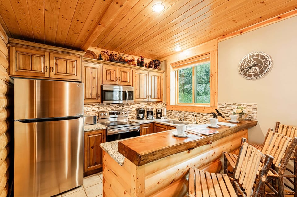 Fully equipped kitchen and bar seating for three