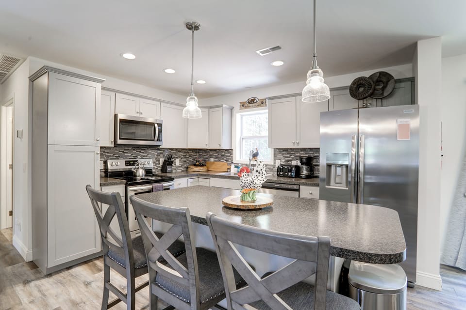 This versatile kitchen island adds counter space, storage, and seating.