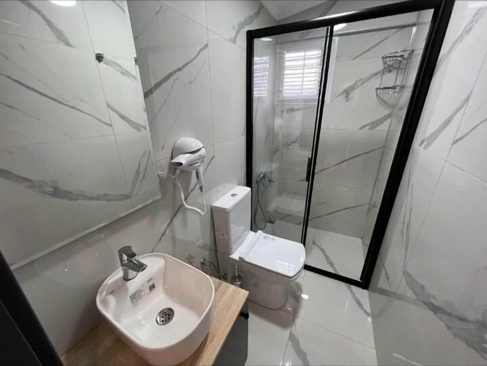 Shower, slippers, towels, soap