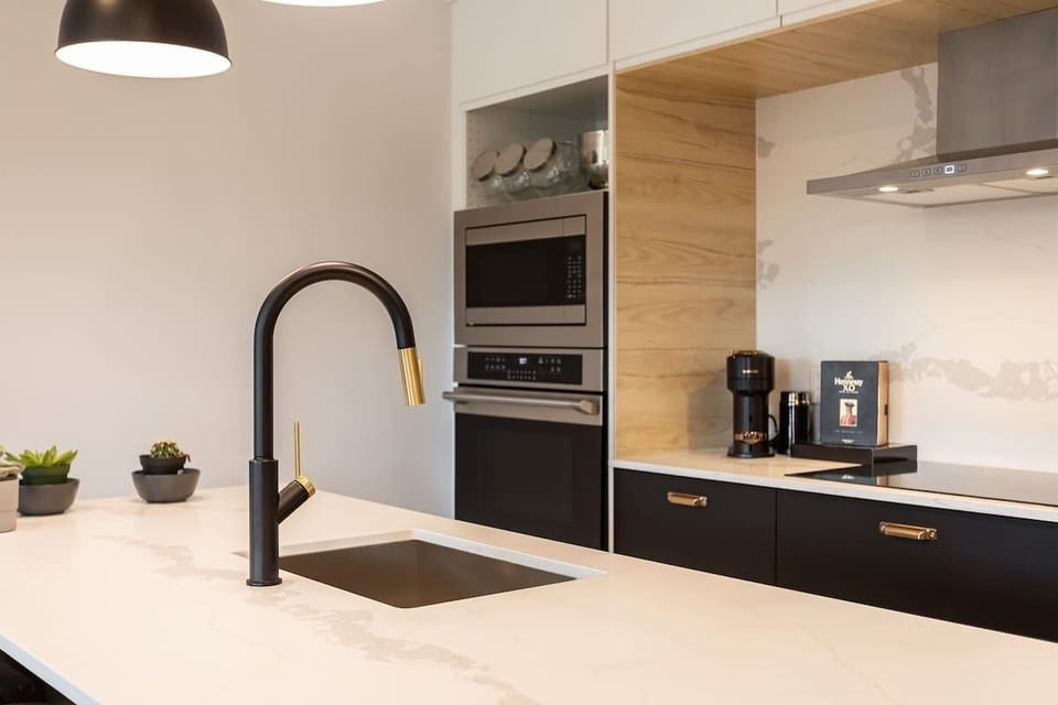 Modern white countertop offering a sleek and stylish space for cooking and gathering.