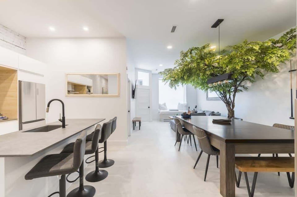 Countertop located just behind the dining area, creating a seamless flow between cooking and dining spaces.