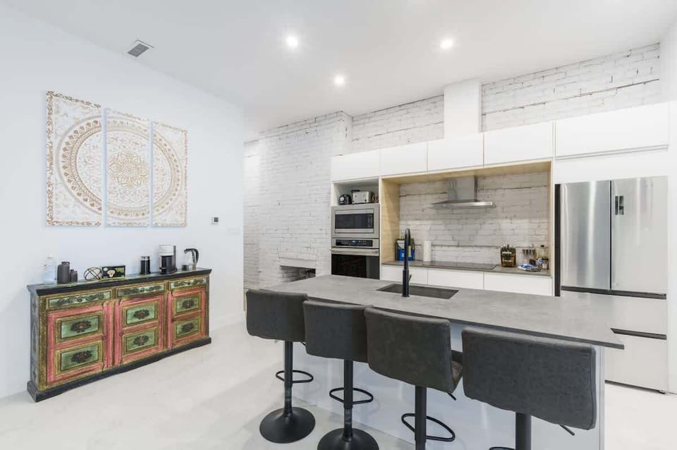 Classy grey and black countertop with a sleek bar area—perfect for entertaining.