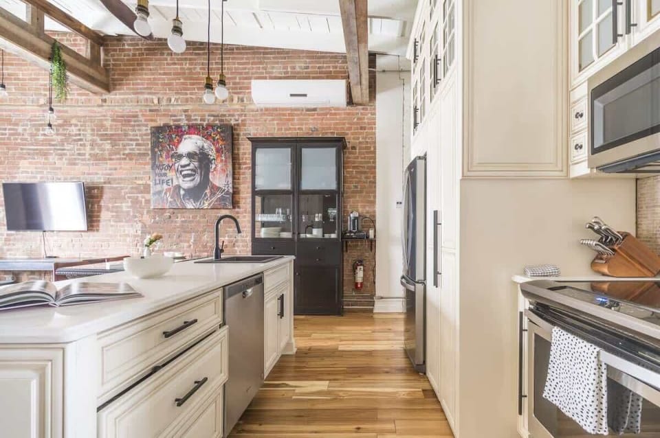 Expansive kitchen countertop paired with sleek vinyl flooring, offering ample space and a stylish, easy-to-clean surface for all your culinary needs.