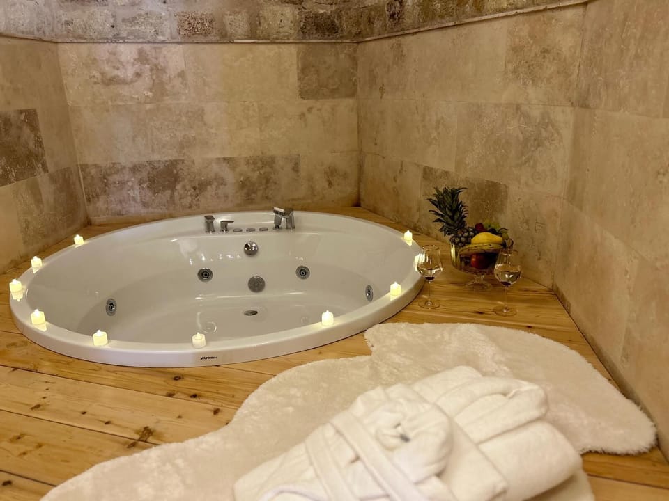 Jetted tub, hair dryer, slippers, heated floors