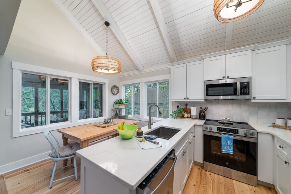 Kitchen/dining area with Stainless steel appliances.