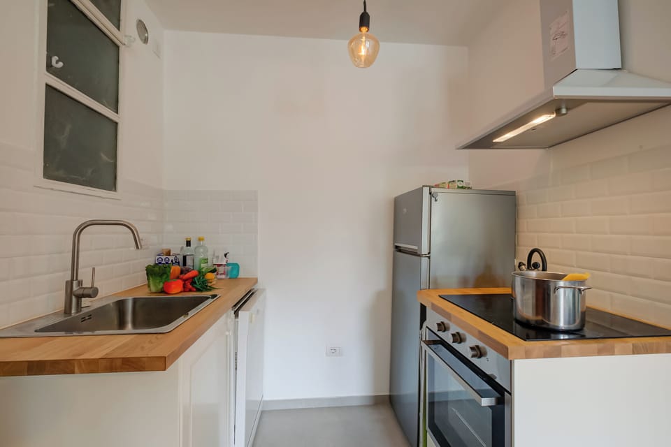 Family Apartment, Multiple Bedrooms (Comfort Tra Fiume E Pini) | Private kitchen | Fridge, microwave, stovetop, dishwasher