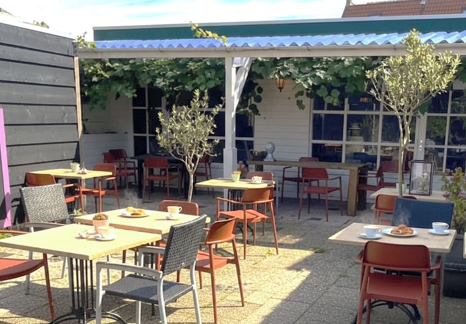 Enjoy your hot coffee and feel the breeze under the sun in this shared/communal space.