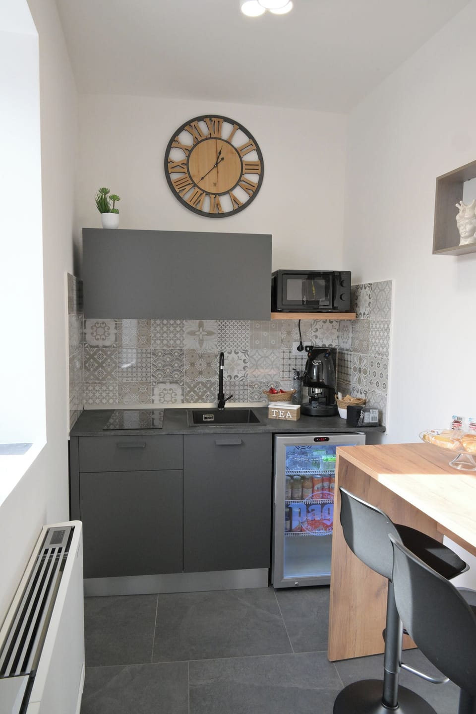 Mini-fridge, microwave, stovetop, cookware/dishes/utensils