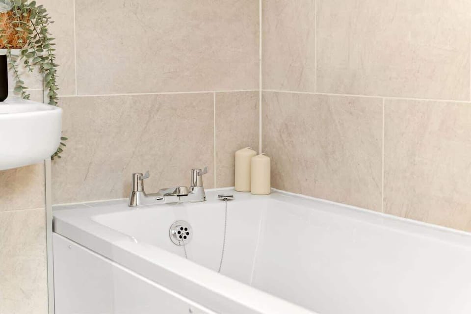 "Indulge in comfort with a full bathroom featuring a spacious tub—perfect for unwinding after a long day."