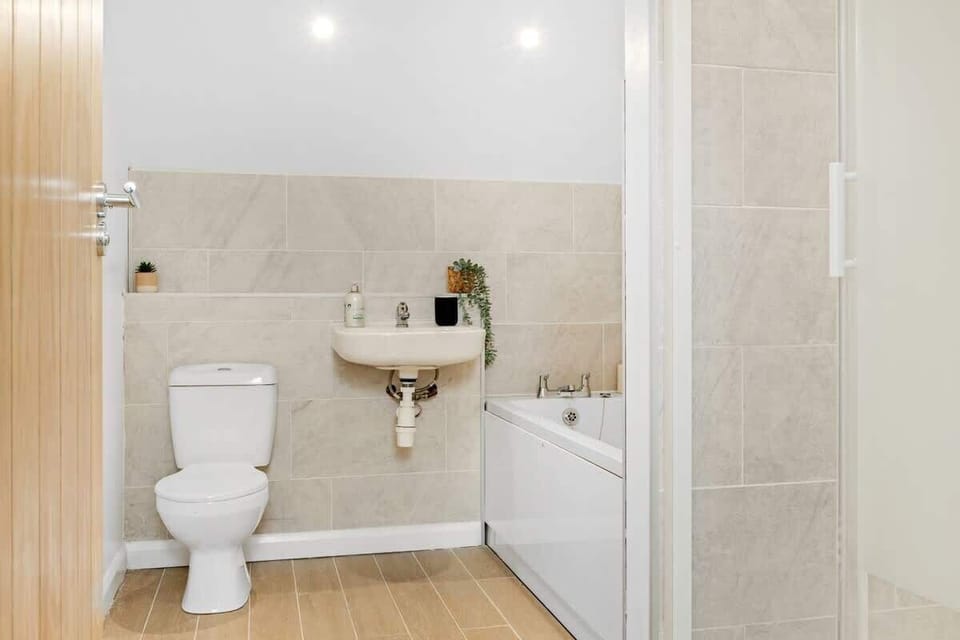 "Indulge in comfort with a full bathroom featuring a spacious tub—perfect for unwinding after a long day."