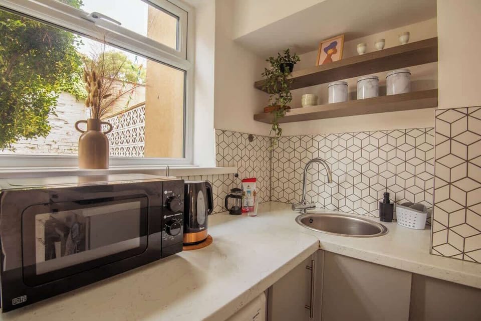 "Everything you need, right where you need it — a simple yet complete kitchen for effortless cooking and comfort."
