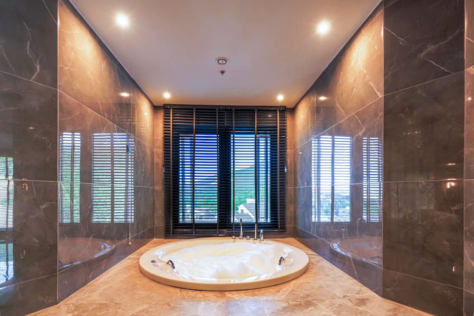 Exclusive Suite, Multiple Beds, Sauna | Bathroom | Free toiletries, hair dryer, bathrobes, slippers
