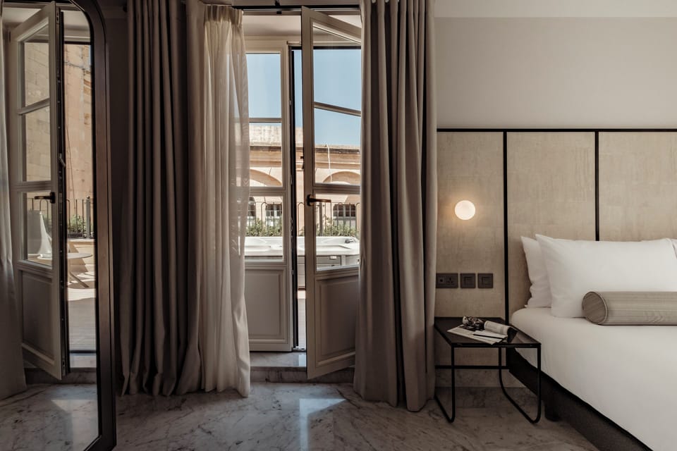 Superior Suite, Patio, City View | Premium bedding, minibar, in-room safe, desk