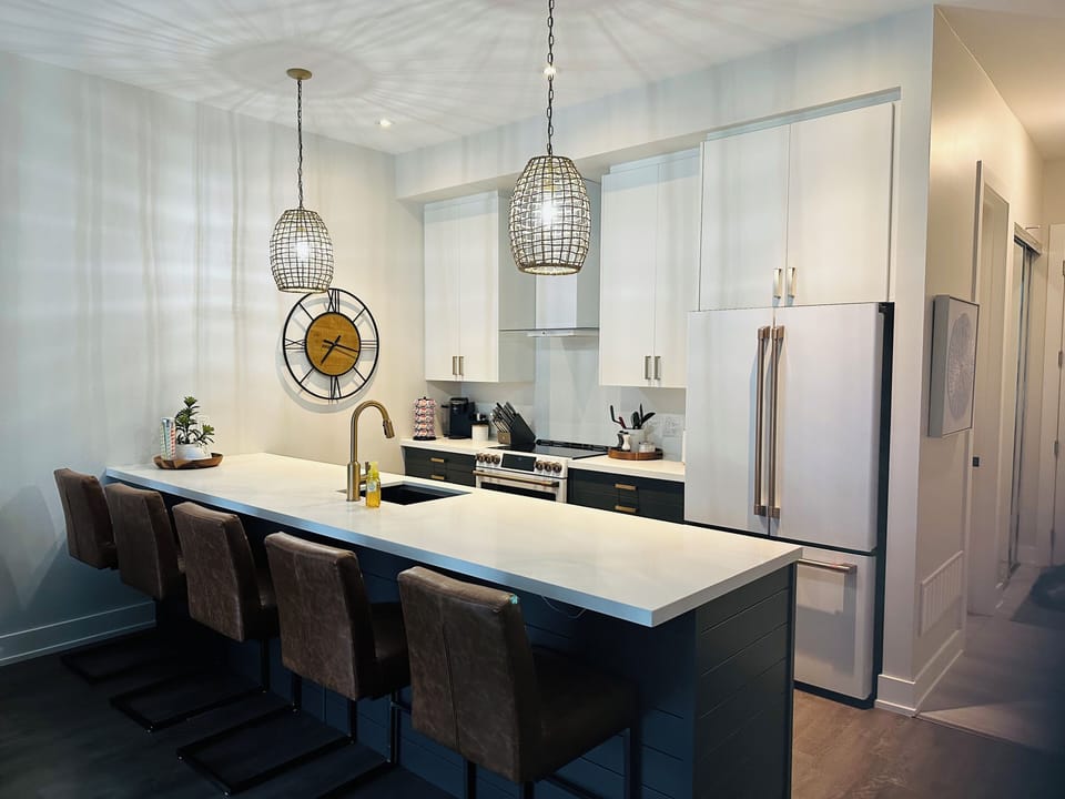 Kitchen area with bar stools