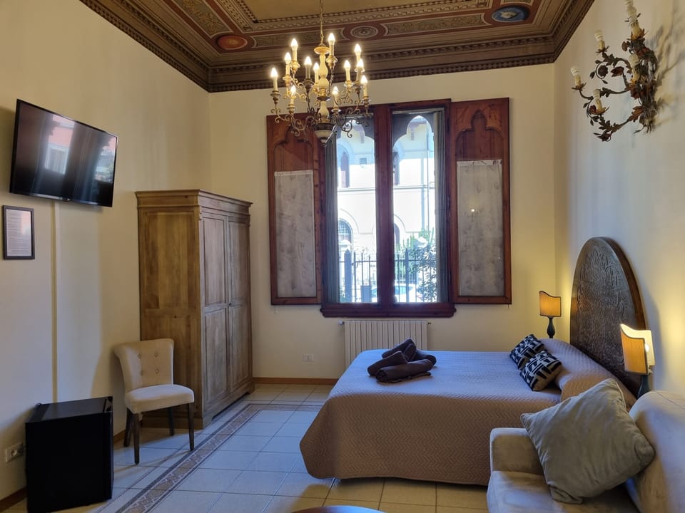 Quadruple Room, Courtyard View | Individually furnished, iron/ironing board, free WiFi, bed sheets