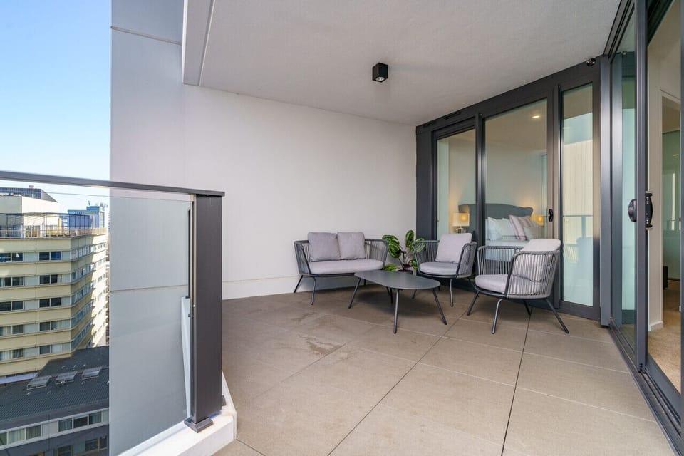 Enjoy a cosy seating area on the balcony, perfect for unwinding after a long day of exploring.