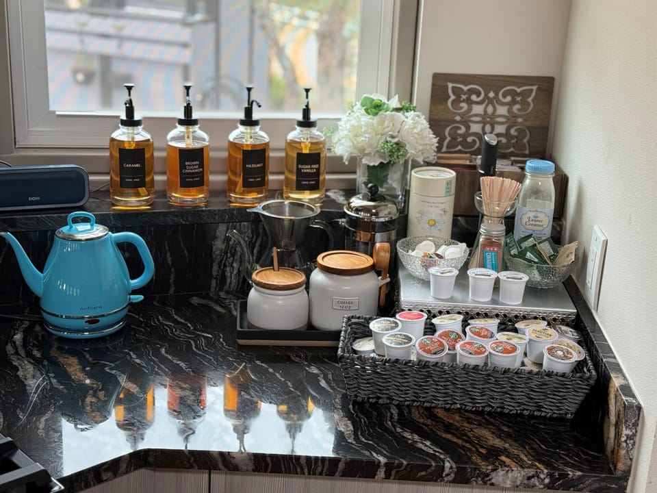 Yurt coffee station with complementary teas, coffees, and sweetners.