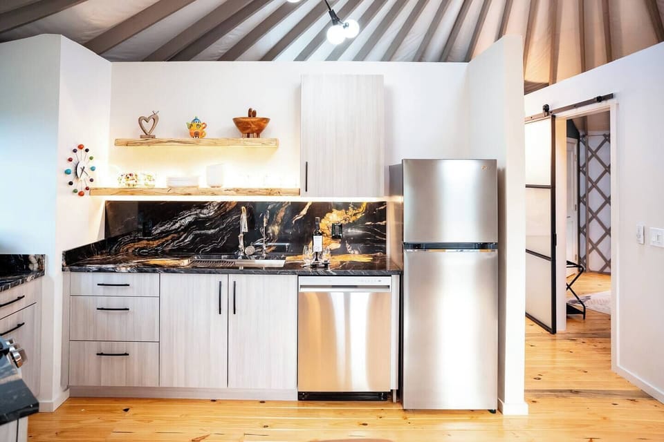 For the gourmet chef, we've left no stone unturned in our ultra modern kitchen with full size refrigerator, dishwasher, appliances, and outdoor barware. You'll have everything you need to prepare gourmet meals for any special occasion. Bon appetit! 