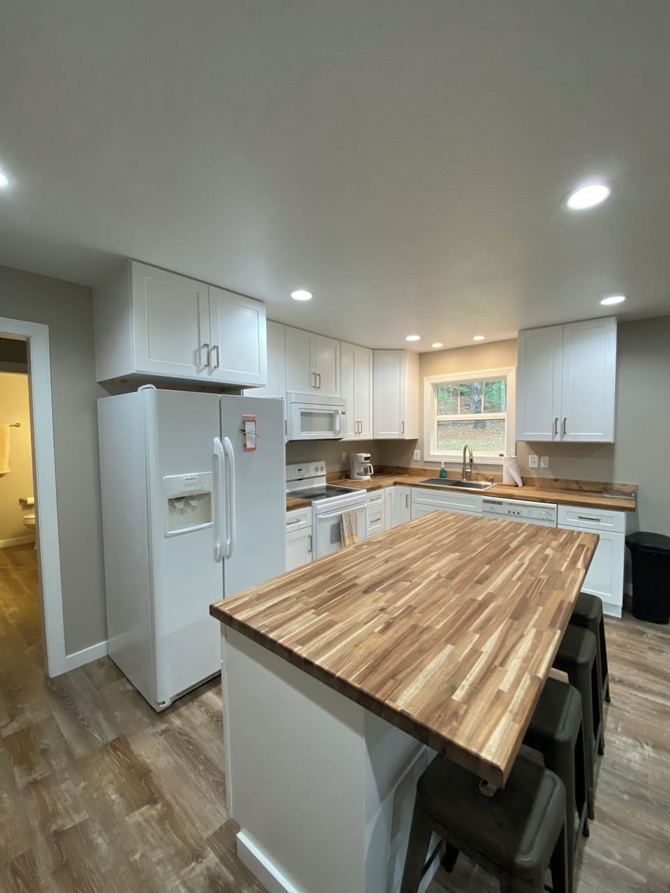 Clean kitchen with seating for four at the island