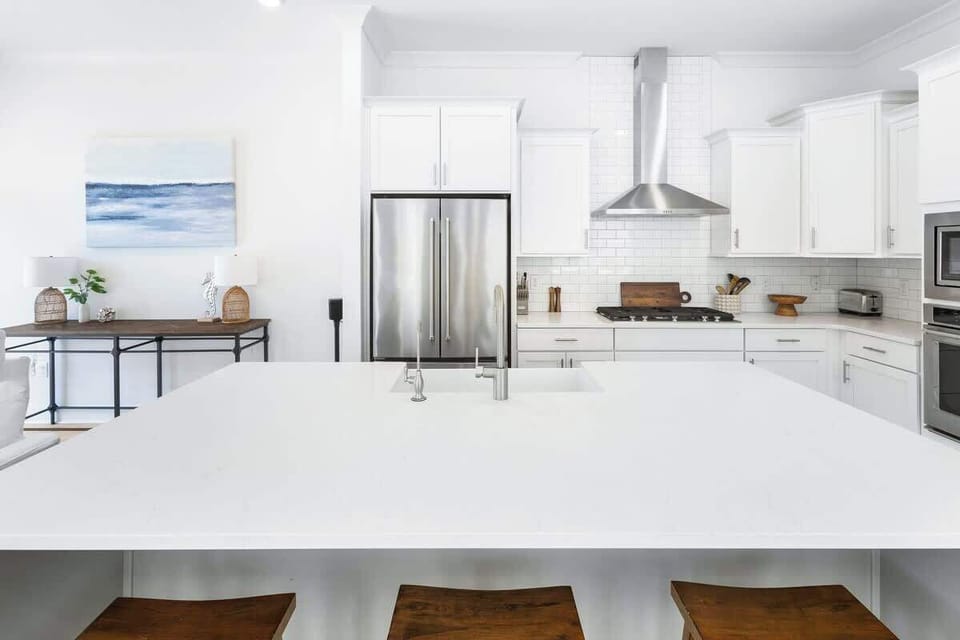 Large kitchen island includes seating for three.
