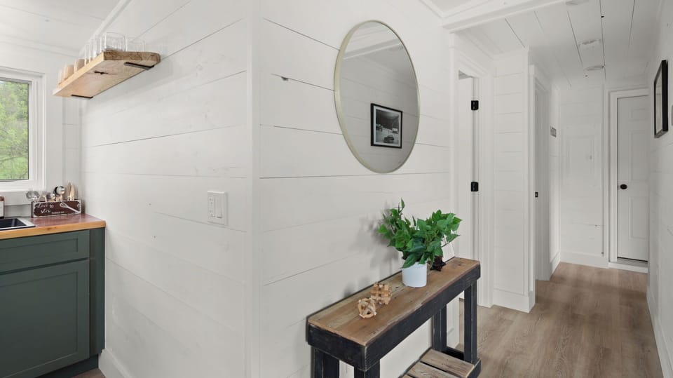 Hallway from kitchen to bath and beds.