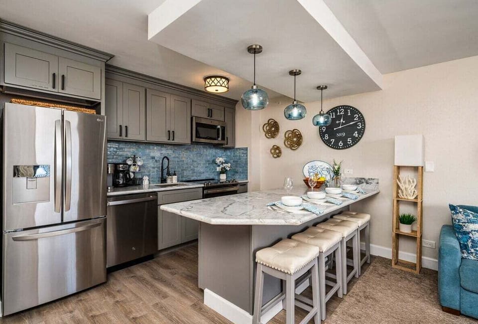 Fully equipped kitchen with quartz countertop and stainless steel appliances